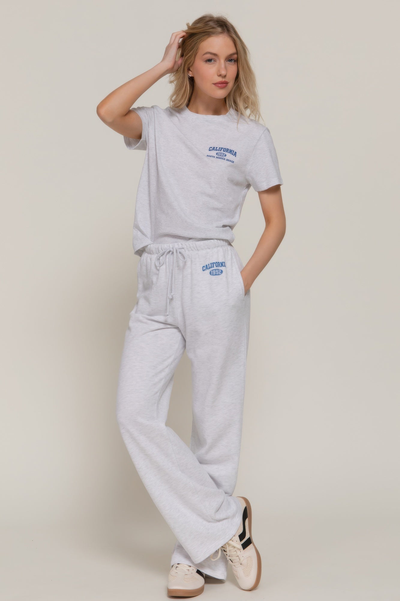 Grey-marl sweatpants set look: drawstring waist and “CALIFORNIA 1992” logo on leg