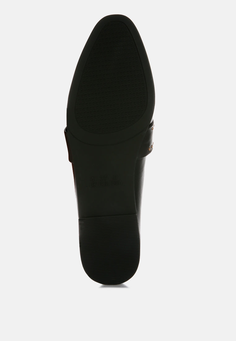 Black outsole view of studded faux leather mules with low, flat heel