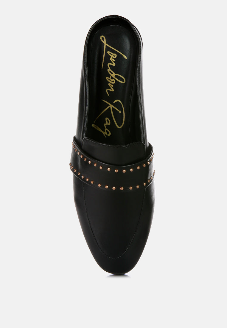 Black mule with open back and studded band; gold-tone studs on faux leather