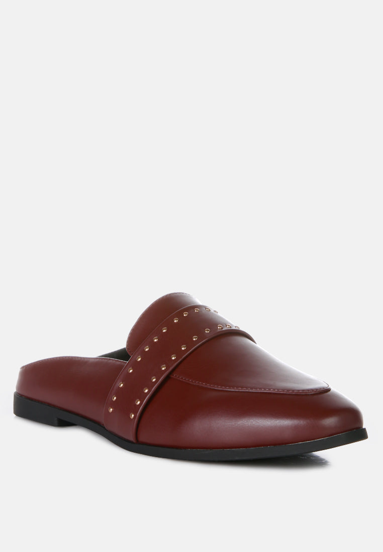Burgundy mule slide with curved vamp, gold studs on strap, low black sole