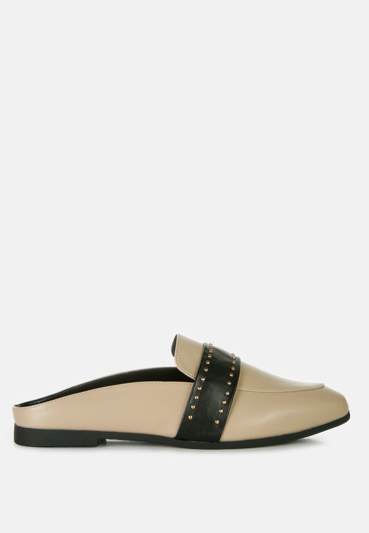 Taupe faux leather mules with black studded strap and low flat sole