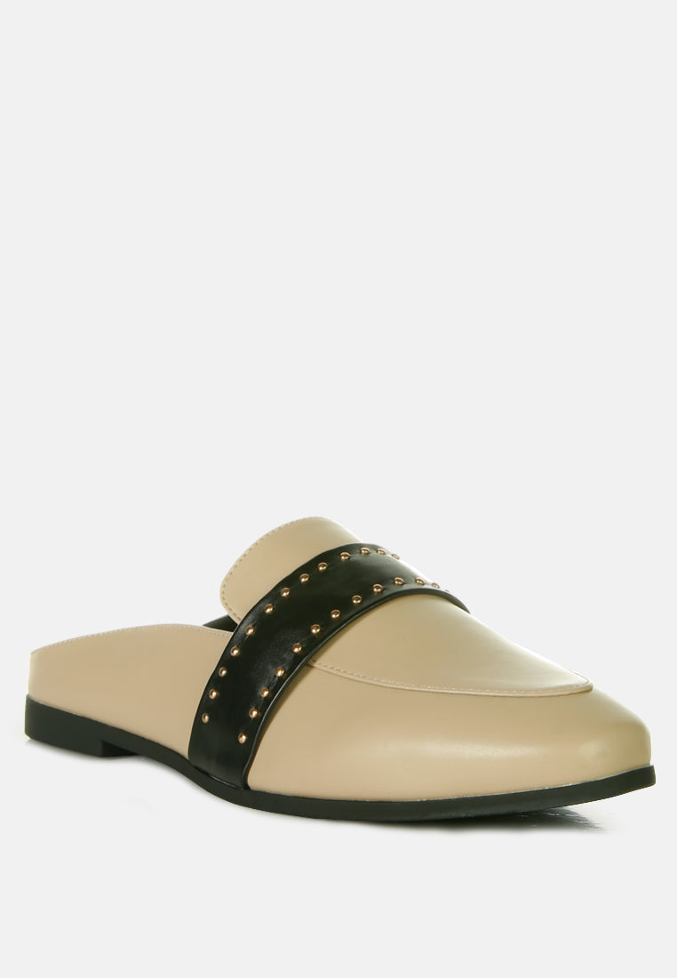 Taupe slip-on mules with black strap featuring gold-tone stud accents