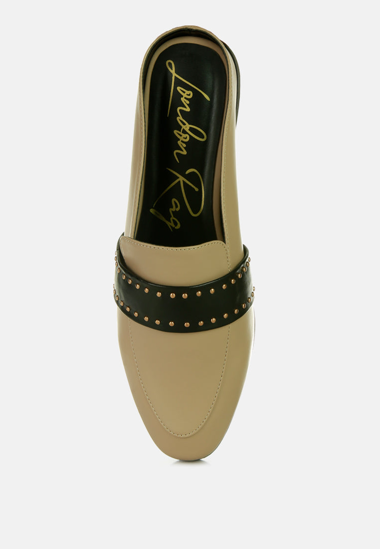 Taupe mule with open collar and black band studded with gold-tone accents