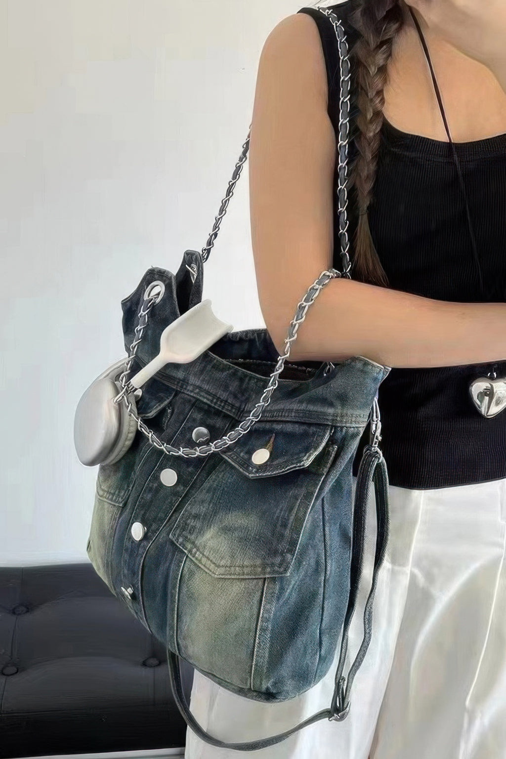Washed denim double-pocket tote with chain shoulder straps and side tie cords