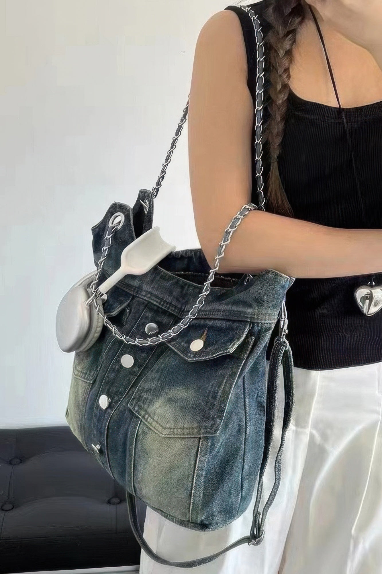 Washed denim double-pocket tote with chain shoulder straps and side tie cords