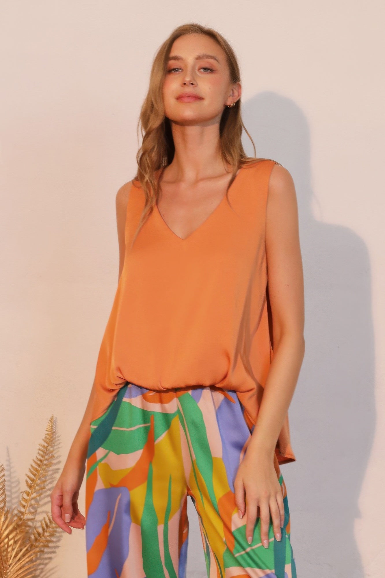 Washed poly silk front tucked top, pumpkin sleeveless V-neck with gathered waist