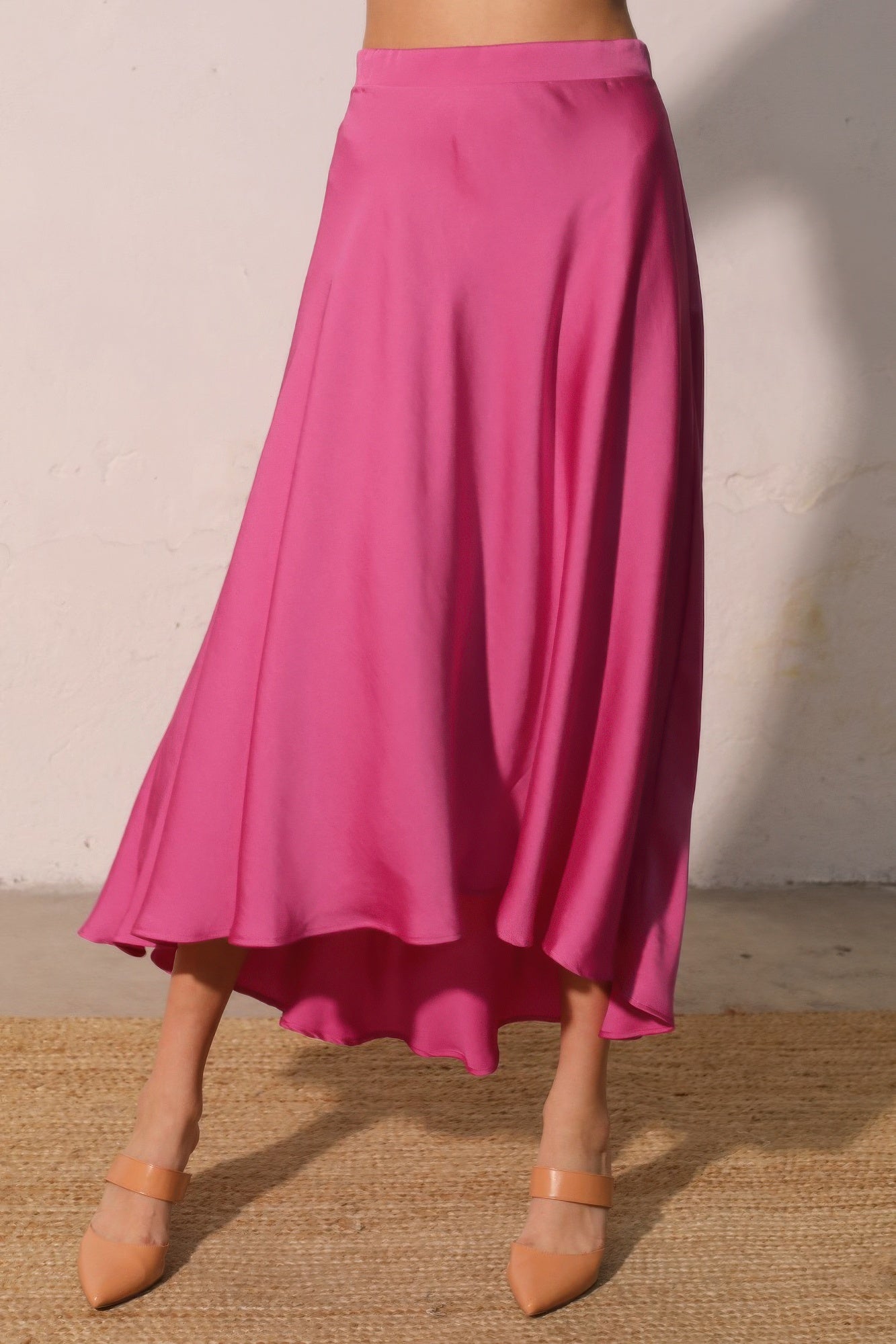 Hot pink midi swing skirt, smooth fabric with elastic waistband and flared hem