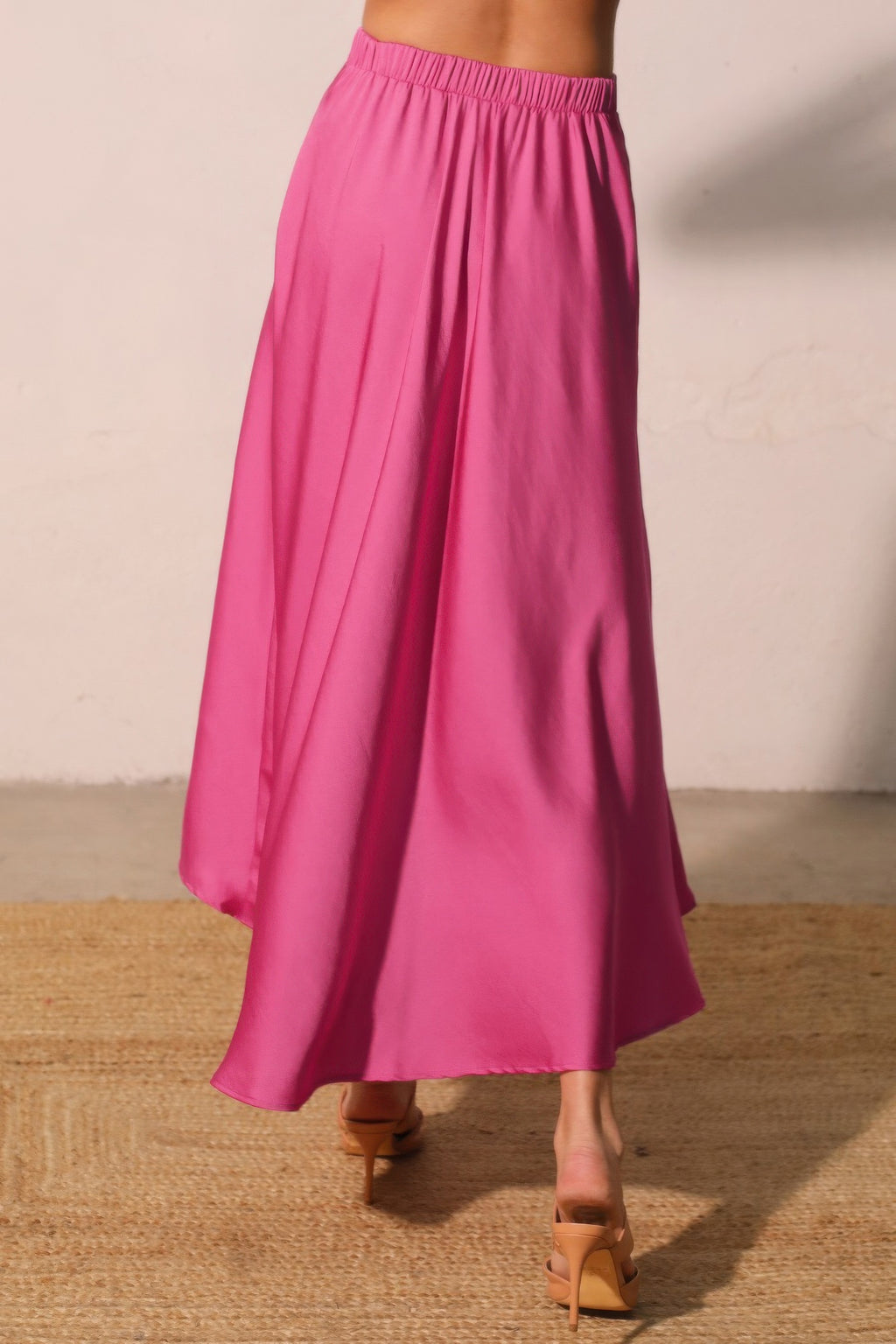 Hot pink pleated midi swing skirt with elastic waistband, full skirt silhouette