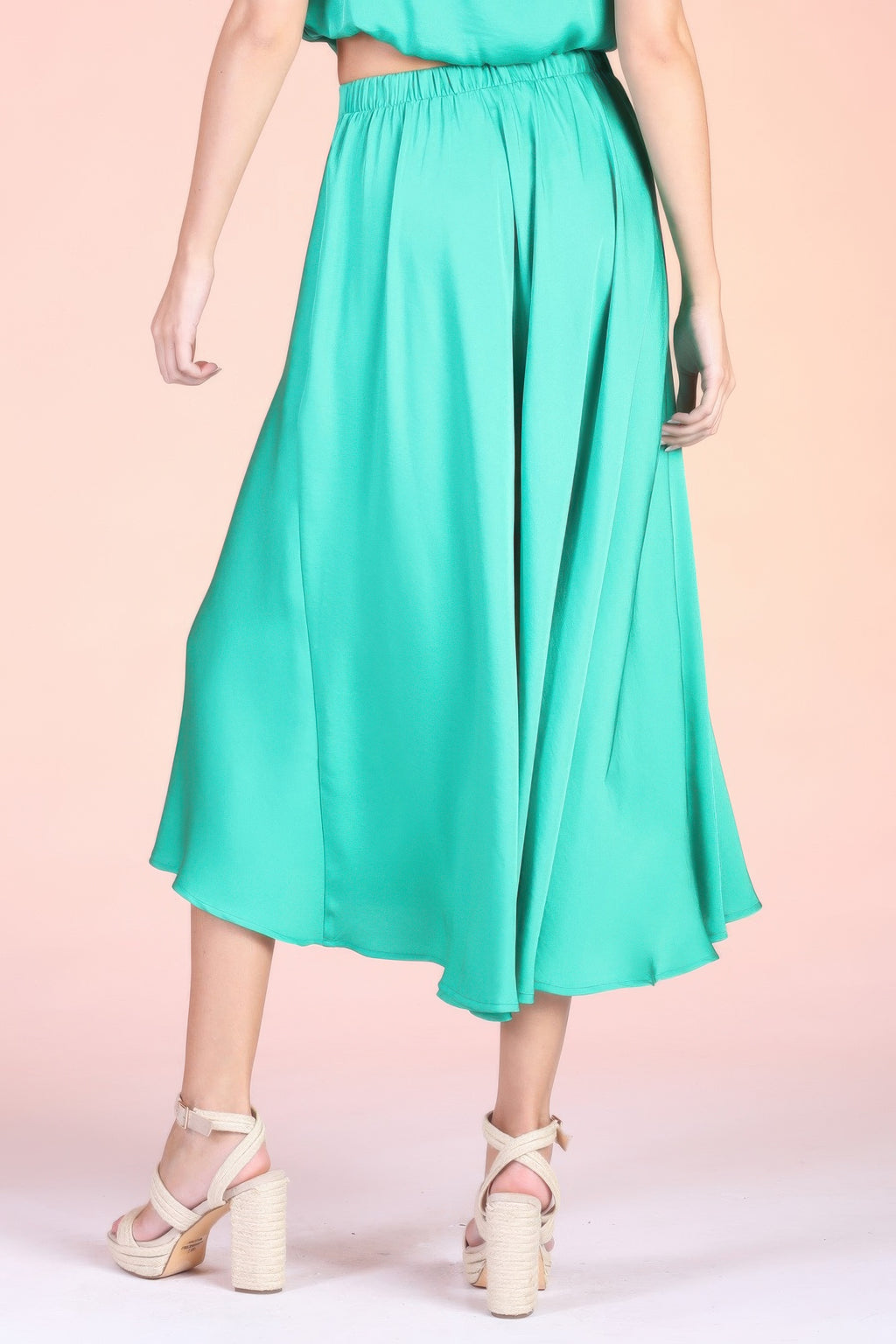 Turquoise midi swing skirt with pleated fullness and elastic waistband, mid-calf