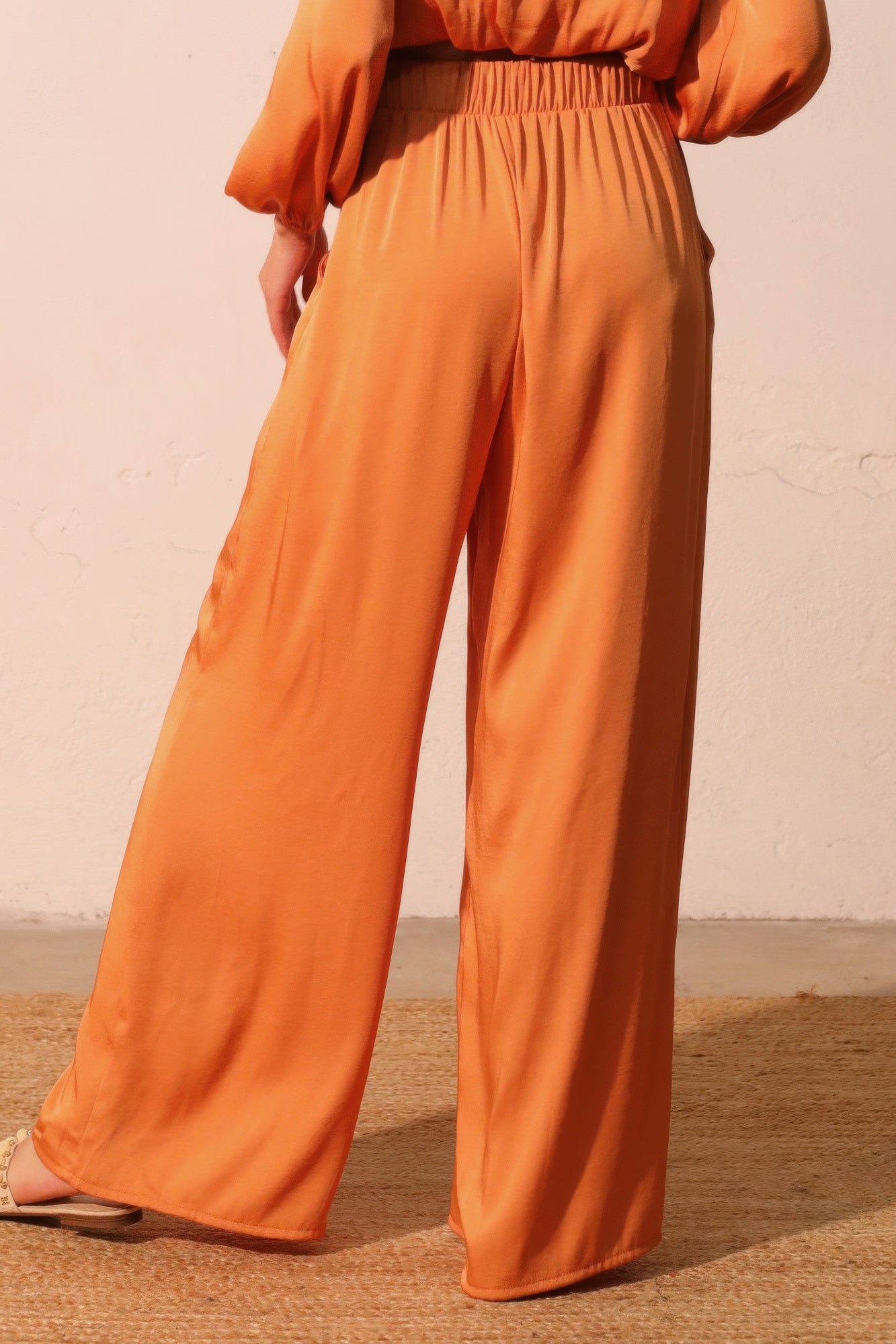 Pumpkin orange washed poly-silk pocket pants, flowy wide leg with gathered waistband