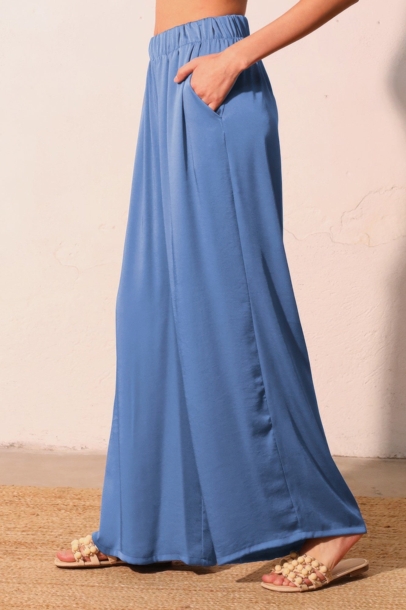 Washed poly-silk pocket pants in washed blue, hand in side pocket, wide drape