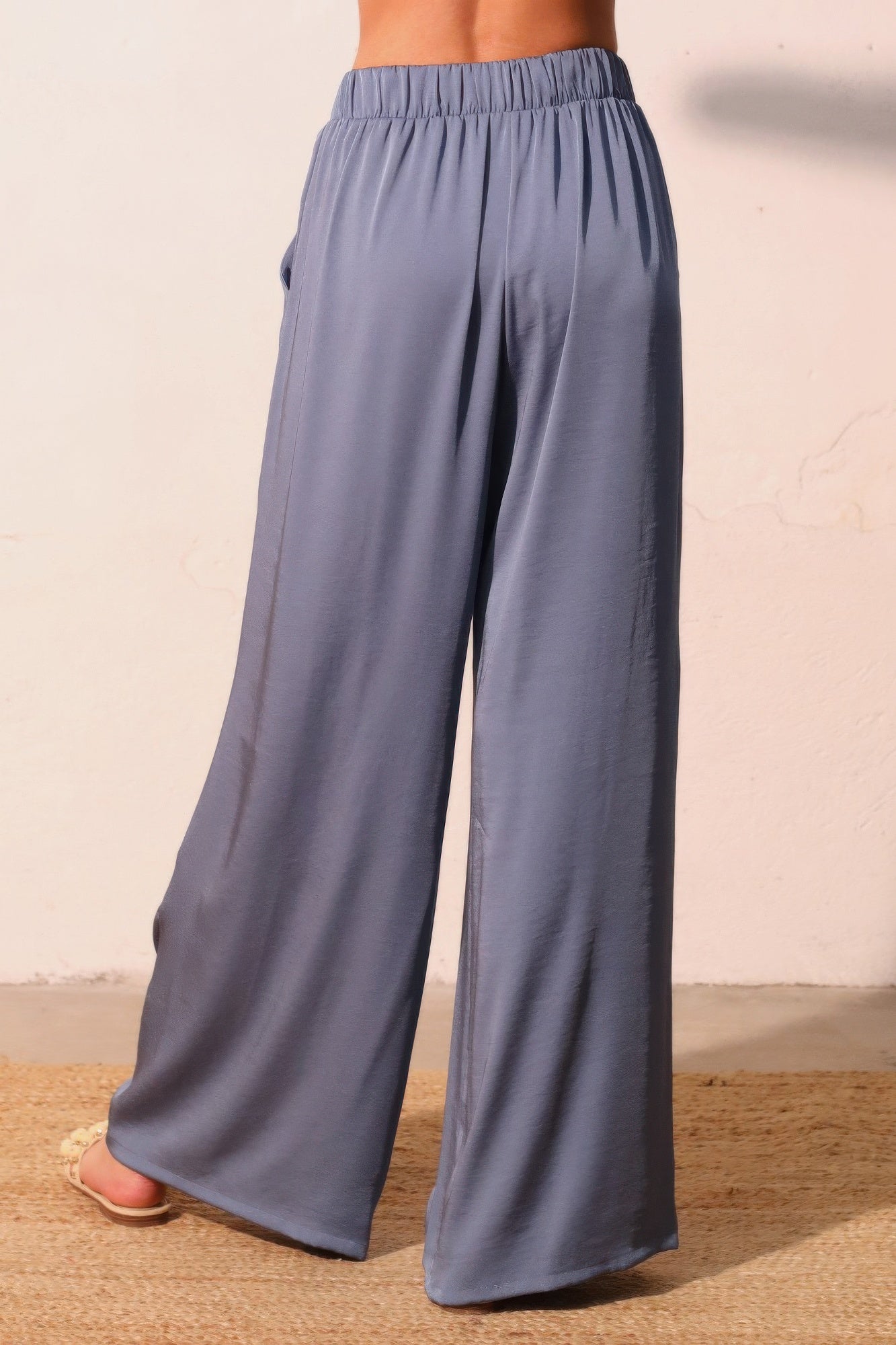 Washed poly-silk pocket pants, darker washed blue, wide-leg silhouette with elastic waist