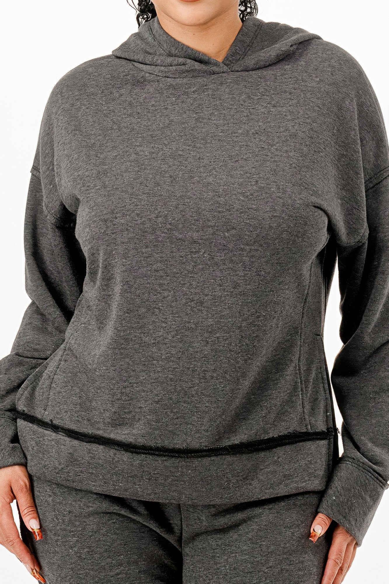 Charcoal hoodie detail with drawstring hood and ribbed waistband