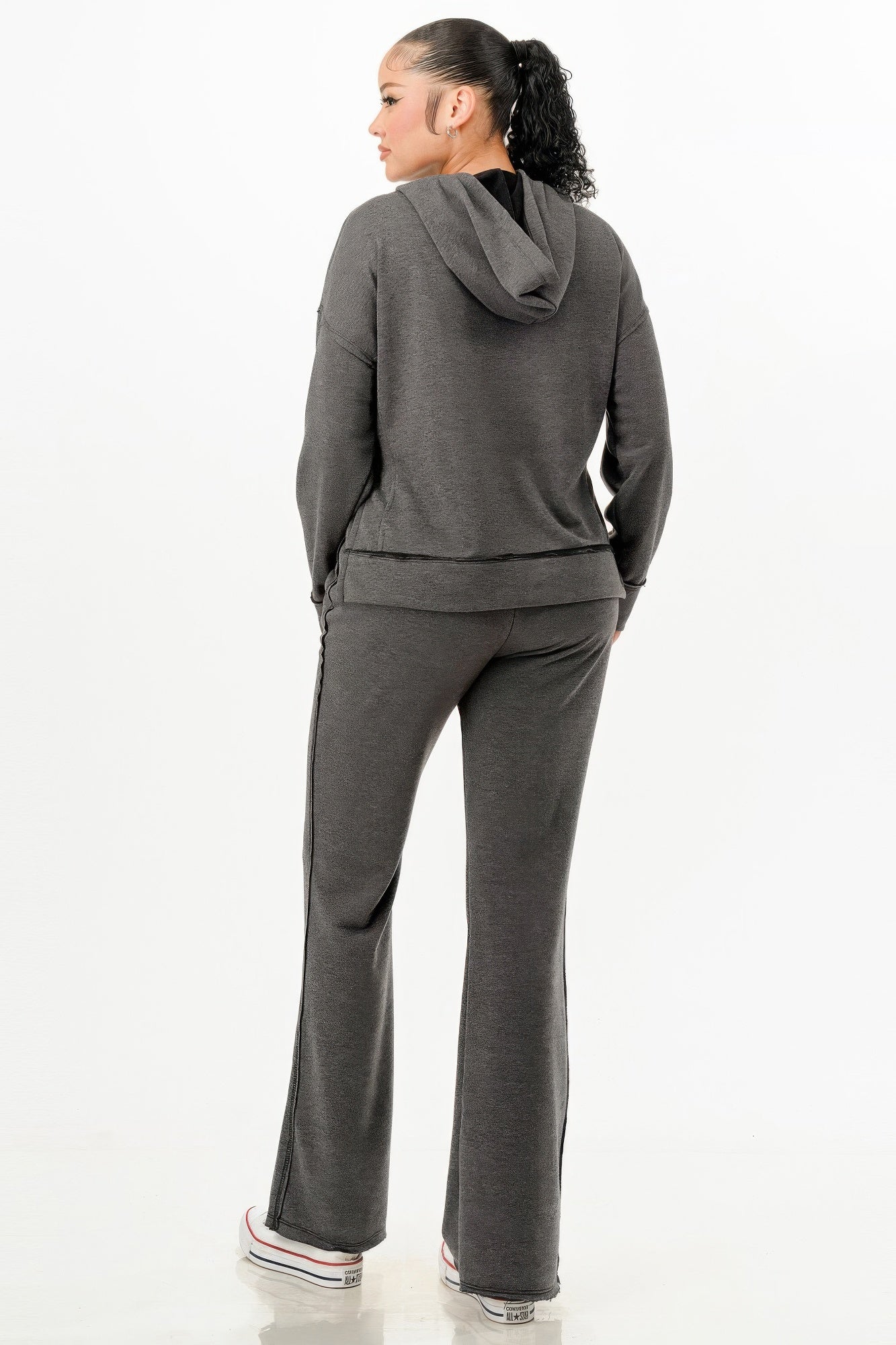 Charcoal two-piece set, back view: pullover hoodie with hood and flare sweatpants