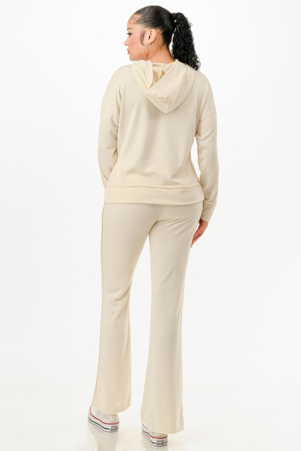Cream two-piece set, back view: hooded sweatshirt with drawstring and joggers