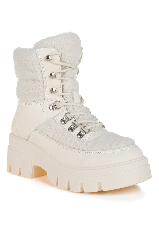 Beige faux-fur lace-up chunky hiker boots with metal eyelets and platform sole