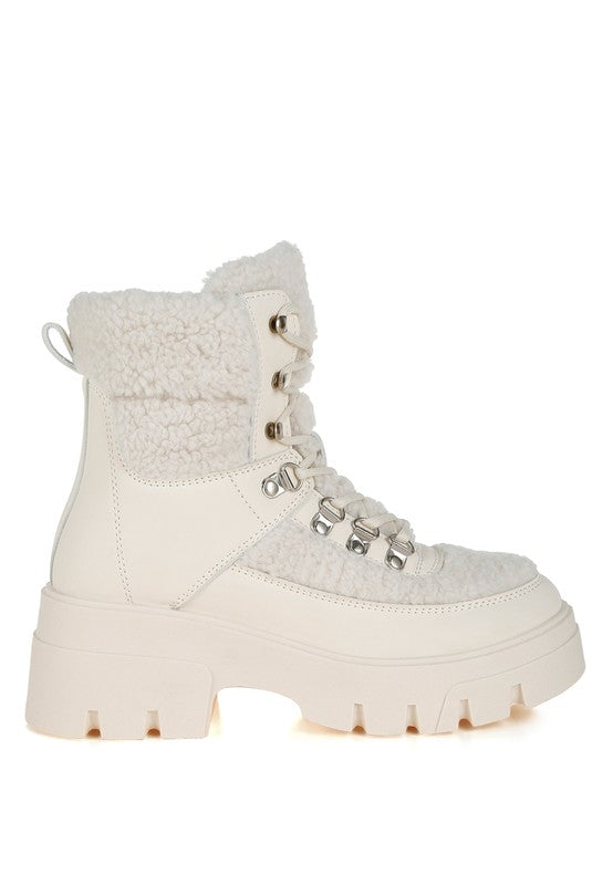 Beige faux-fur lace-up hiker boot with rear pull tab and thick sole