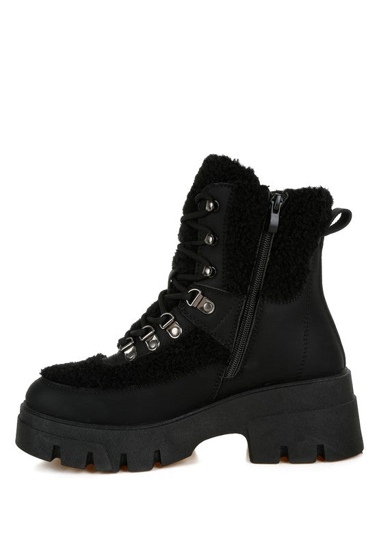 Black faux-fur hiker boots with lace-up front and side zipper detail