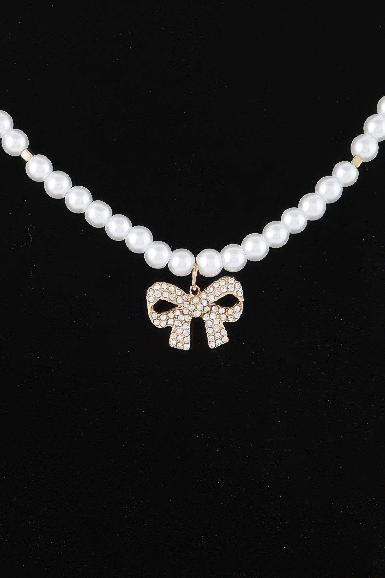 Double-row pearl bow necklace, gold-tone bow charm with clear stones