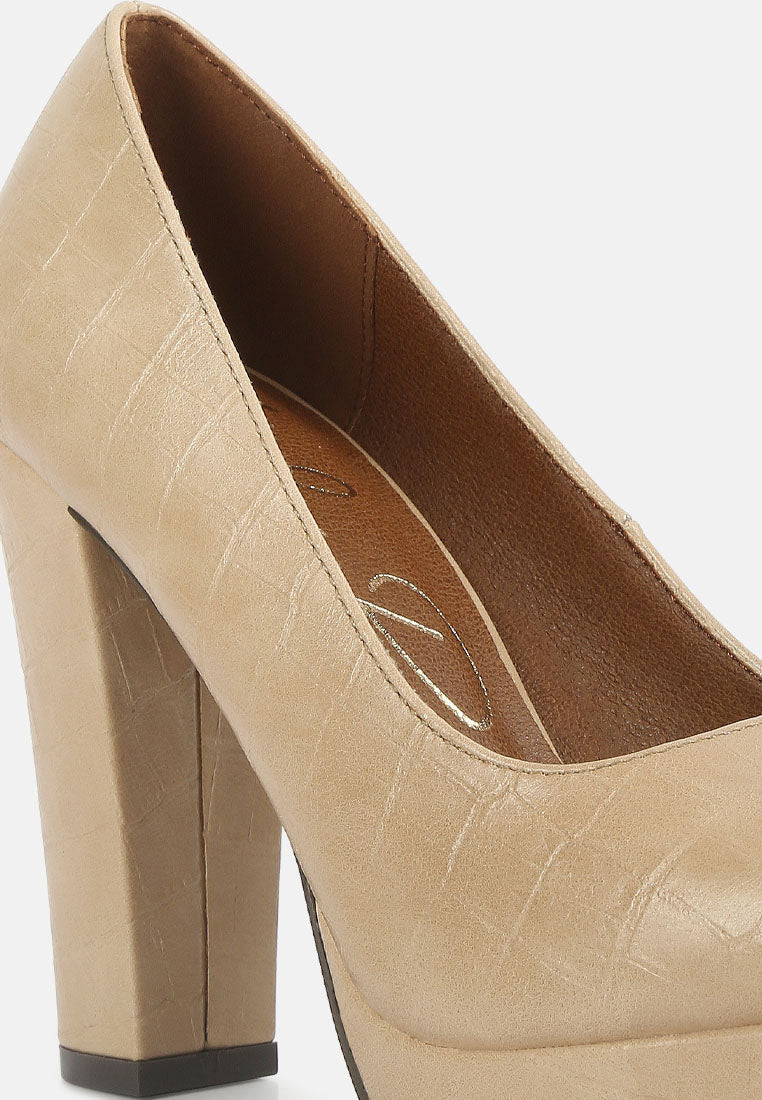 Beige croc-texture high block heel pump close-up of side profile and stitching