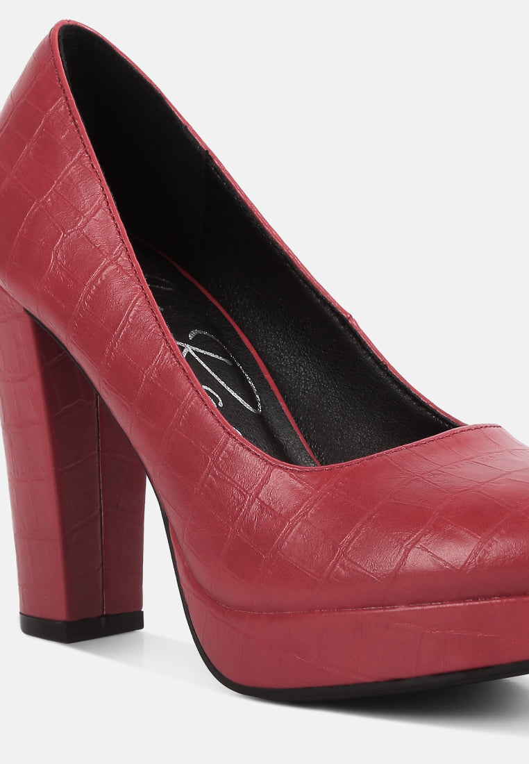 Red croc-texture high block heel pumps with closed toe and platform sole.