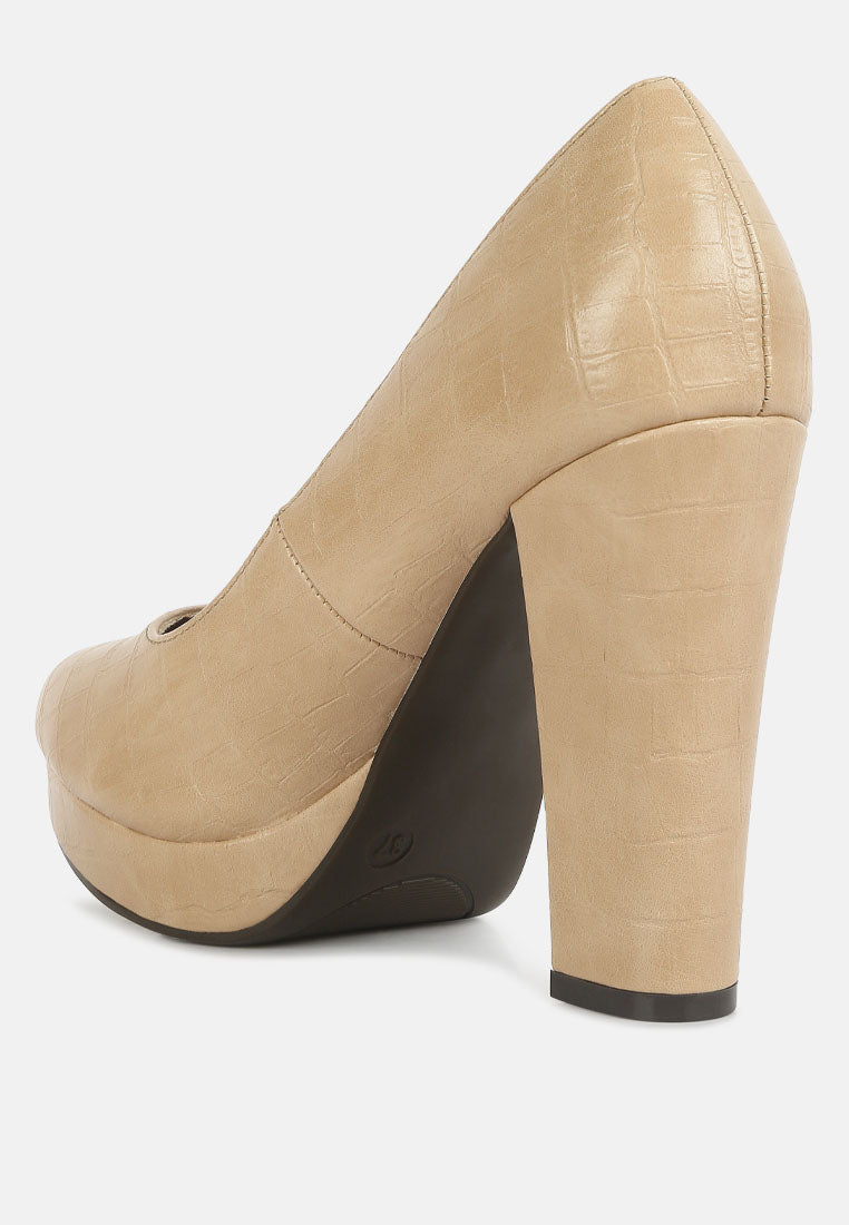 Beige croc-texture closed-toe pump showing thick block heel and platform sole