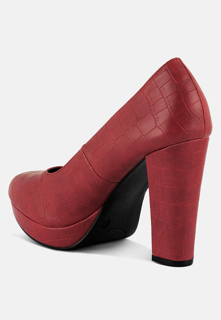 Red croc-texture closed-toe pump showing platform toe and high block heel