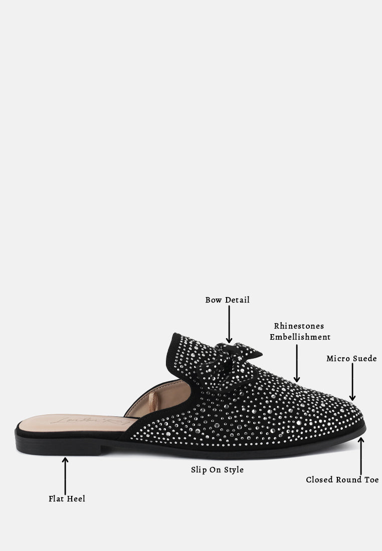 Black slip-on bow mule with rhinestone embellishment, flat heel, closed round toe