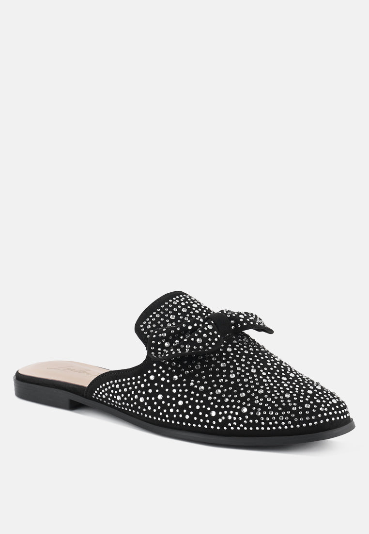 Black rhinestone bow mule, angled side view with low outsole and slip-on fit