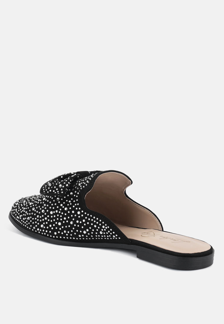 Black bow mule slide with rhinestone-studded upper and beige-lined insole