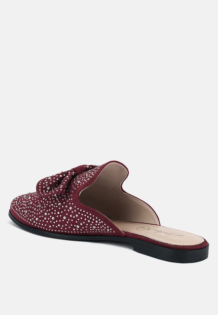 Red bow mule slide with open side cutout, rhinestone-studded upper and black sole