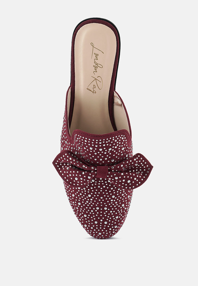 Red rhinestone bow mule from above, closed round toe and textured micro suede upper