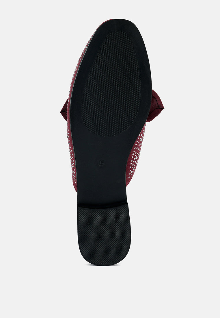 Black mule sole view with red rhinestone upper trim and bow detail