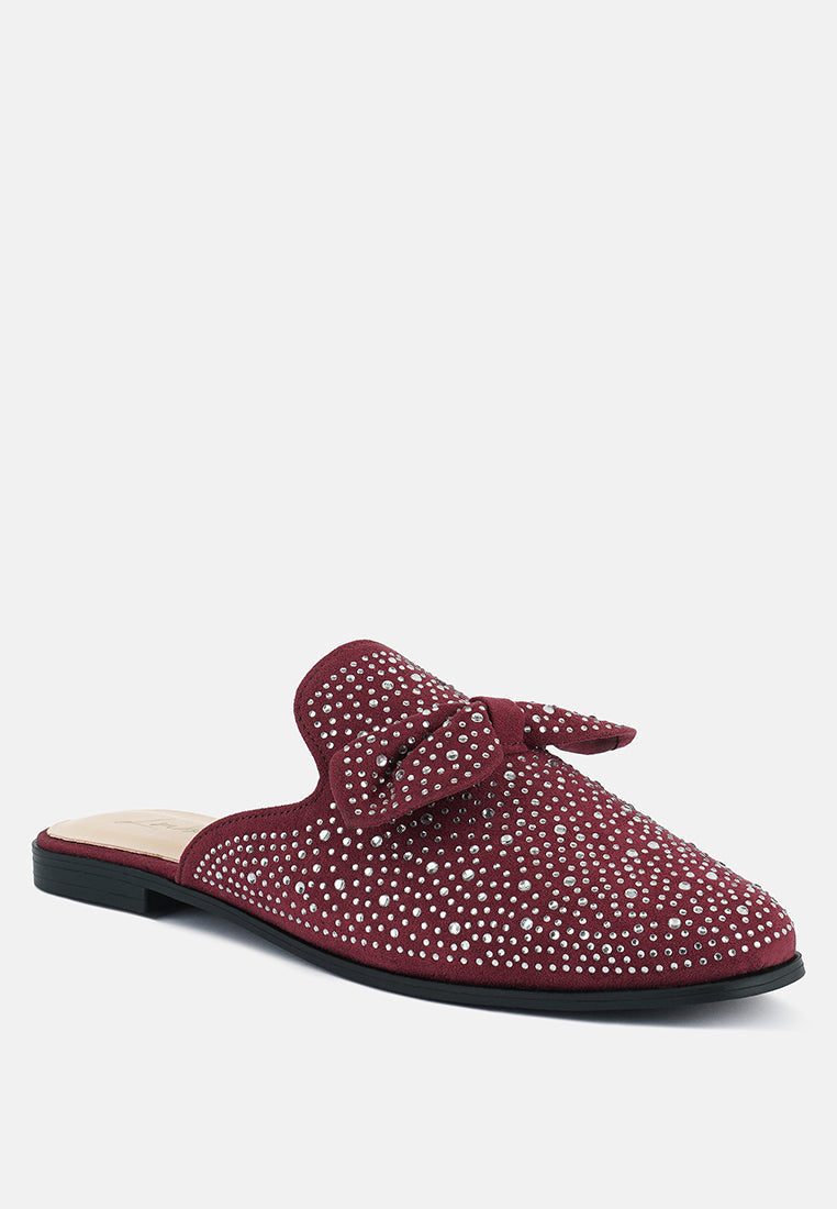 Red rhinestone bow mule, side view with low black outsole and slip-on design
