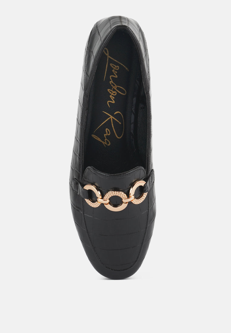 Black loafer front view with gold-tone chain hardware and round toe