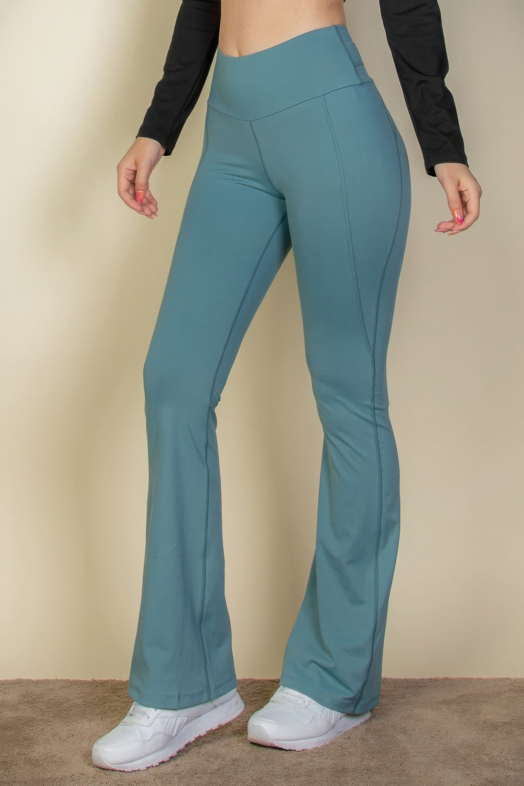 Slate green flare-leg pants, high wide waistband and flared hem