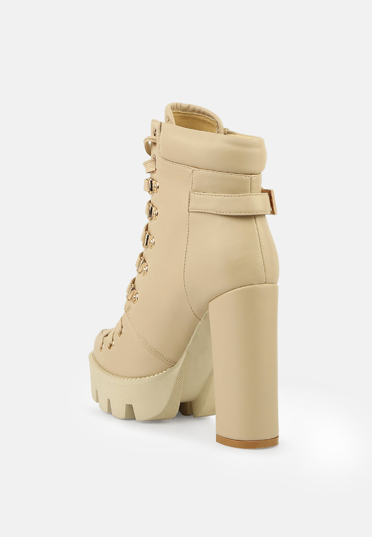 Beige combat boot side view with lace-up closure and chunky lug platform outsole