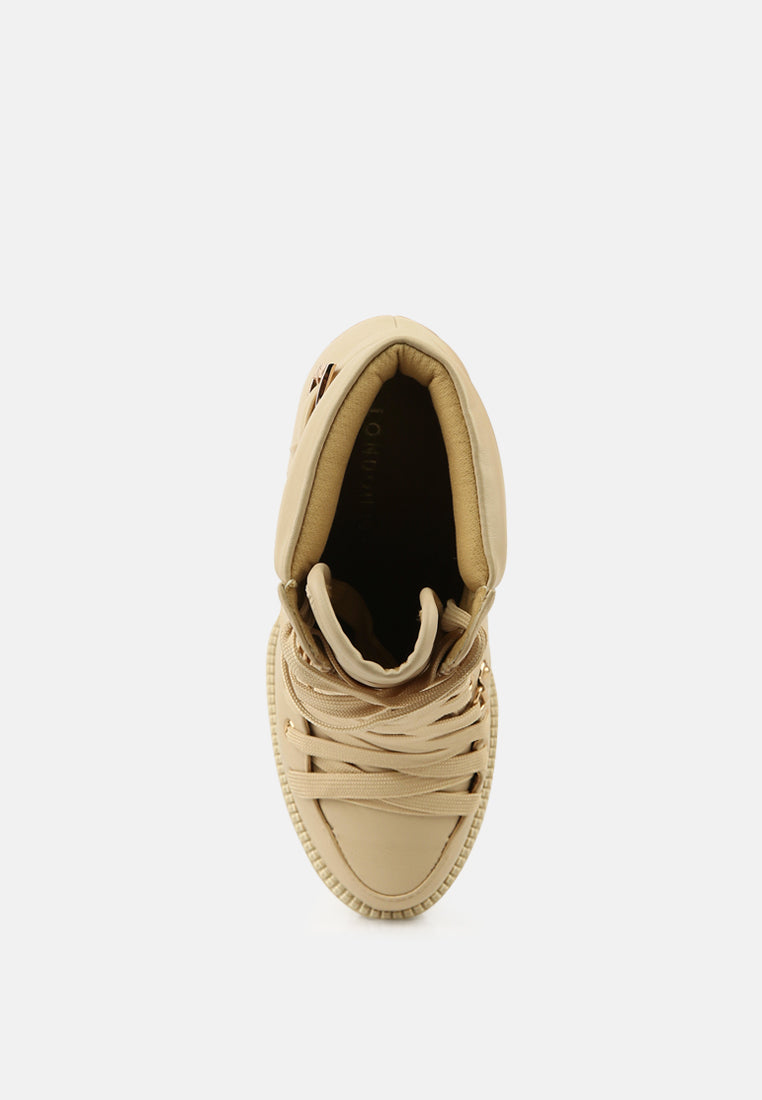 Beige combat boot interior lining visible, lace-up upper and platform sole