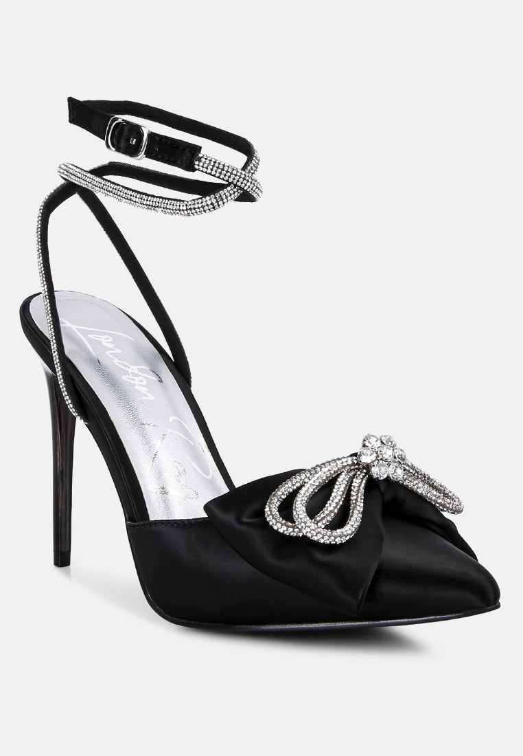 Black pointed-toe high heel sandals with rhinestone bow and ankle strap
