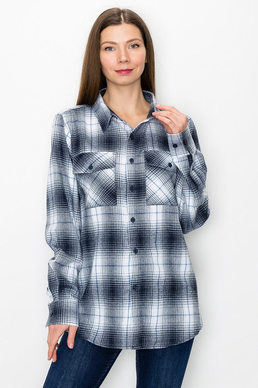 Long sleeve flannel in light blue and white plaid, button-up with chest flap pockets