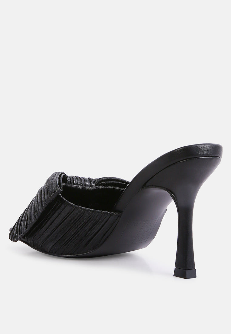 Black bow slider sandals, side view with high stiletto heel and gathered strap