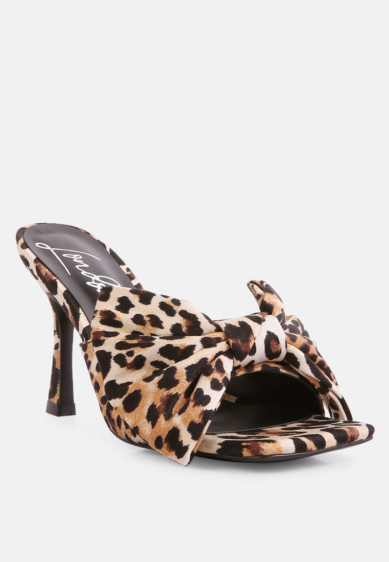 Leopard print heeled slide sandals with knot bow across the front strap