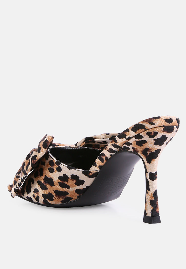 Leopard print mule-style slider heels with black lining and open side cutouts
