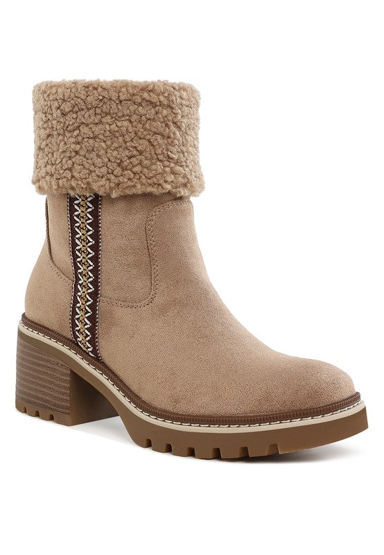Beige faux fur cuff boot with embroidered side panel, chunky wood-look heel and lug sole