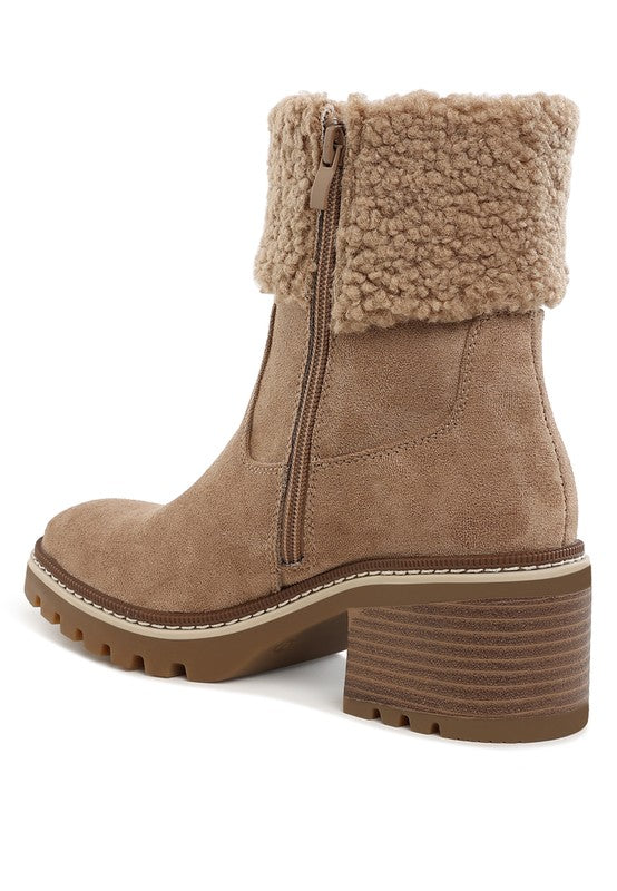 Beige ankle boot with back zipper, fuzzy cuff, and chunky stacked heel with tread sole