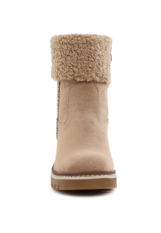 Beige tall ankle boot with faux fur cuff, smooth suede-look upper, and stacked heel