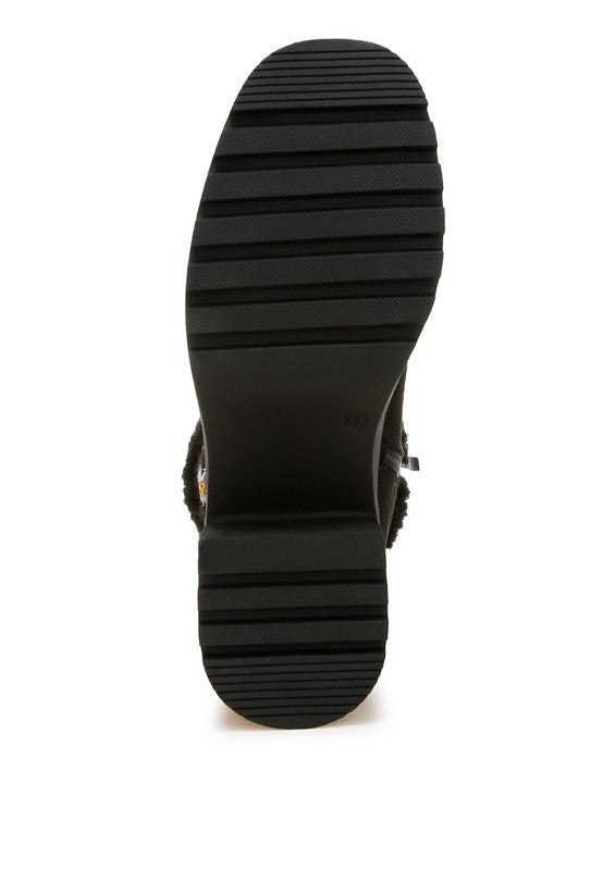 Black lug outsole with ridged tread for traction on ankle boot