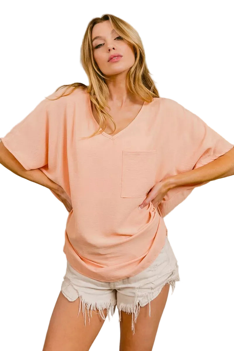 Peach V-neck boxy hi-low top with side ruched tie detail and chest pocket