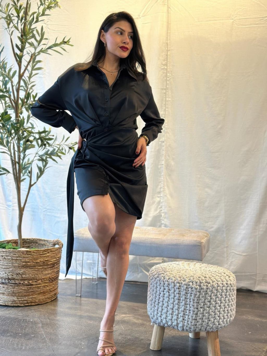 Black satin wrap mini dress, long sleeves, button front, tied waist