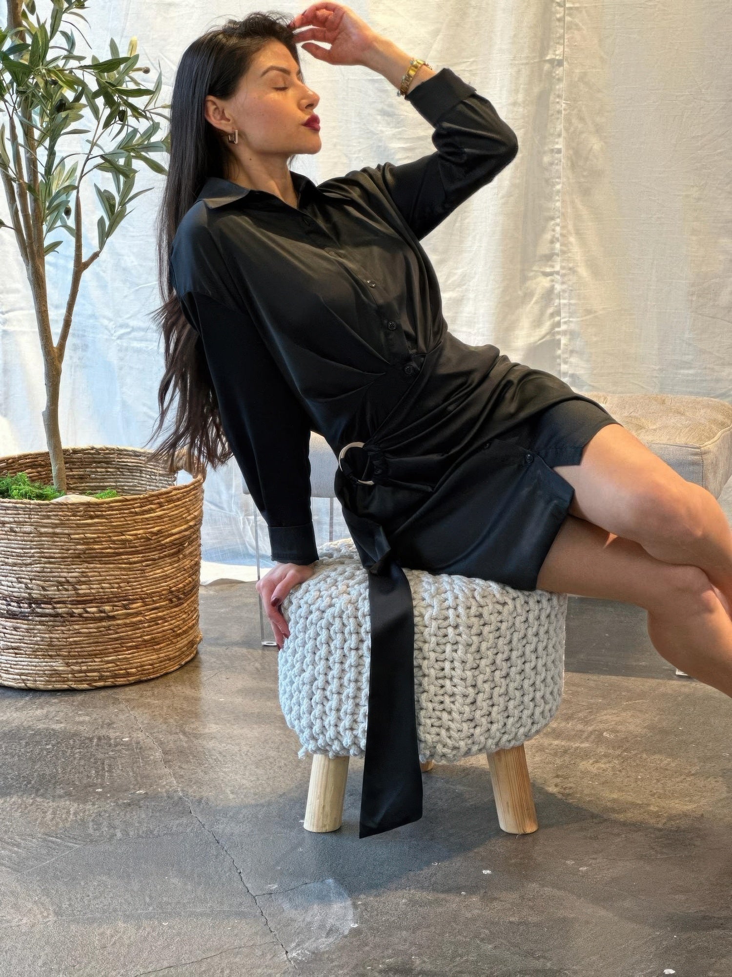 Black satin long-sleeve wrap mini dress, side drape detail and tied belt